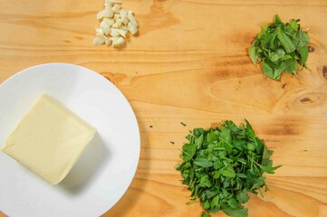 Herb butter isolated on wooden background