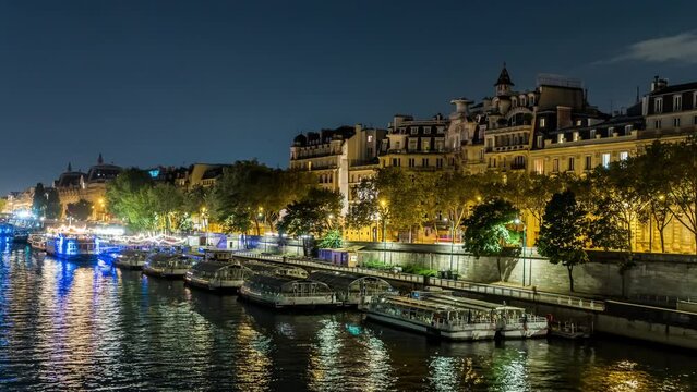 Night Traffic at Paris Seine River With Boats Docks and Buildings