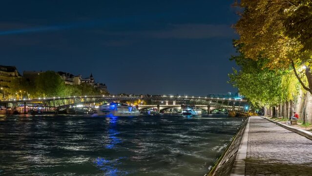 Touristic View of Paris at Night Seine River and Pedestrians Docks Bridges and Boats Cruises
