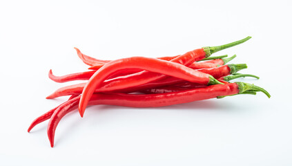 Fresh red peppers on white background