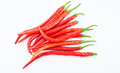 Fresh red peppers on white background