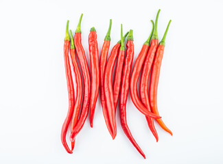 Fresh red peppers on white background