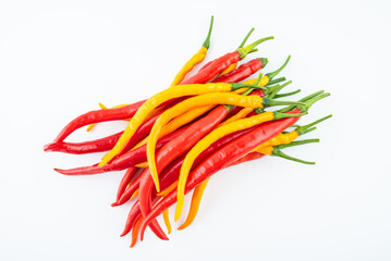 Fresh yellow and red peppers on white background