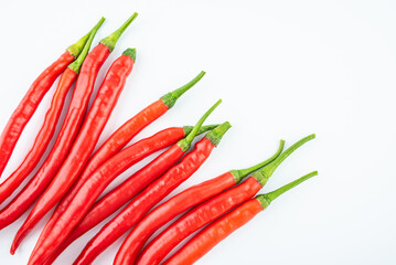 Fresh red peppers on white background