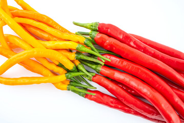 Fresh yellow and red peppers on white background