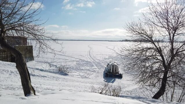 hovercraft rides on the frozen lake. High quality 4k footage
