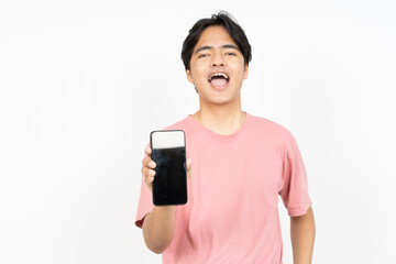 Holding smartphone and showing blank smartphone screen of Asian Man Wearing T-Shirt Isolated On White Background