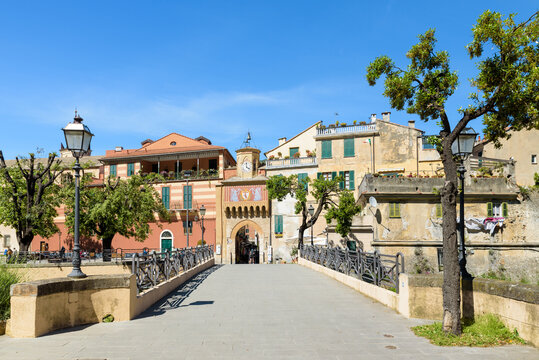 Finalborgo, Finale Ligure, Italy. May 5, 2021. View of the facade of the ancient Porta Testa from the bridge over the Tora stream.