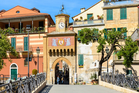 Finalborgo, Finale Ligure, Italy. May 5, 2021. View of the facade of the ancient Porta Testa from the bridge over the Tora stream.