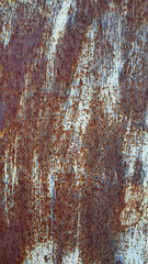 Texture of a painted metal wall covered with rust