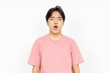 Shocked face of Asian man in shirt on white background.