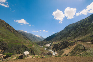 Fototapeta premium Beautiful View to the Pakistani Highland Gorge with the Mountain River in Gilgit Baltistan, Pakistan