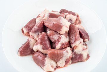 A plate of fresh chicken hearts