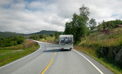 VR Caravan car travels on the highway.