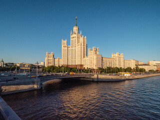 Fototapeta na wymiar Moscow in summer. View of the city from the Bolshoy Ustinsky Bridge. A skyscraper on the Kotelnicheskaya embankment in the style of the Stalinist Empire.
