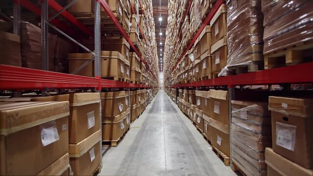 A warehouse with many boxes on its shelves waiting for export. Supply chain management concept