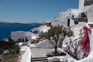 White architecture on Santorini island, Oia, Greece. White architecture. Summer vacation and holiday concept, luxury travel. Wonderful scenery, cruise ships and white architecture. Amazing landscape