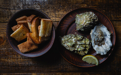 Oysters and toasted bread Freshly caught sea mollusks Natural proteins