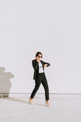 Fototapeta premium Young business salesperson woman selling and prospecting on the phone. Expert young and successful saleswoman building rapport with her client. Concept about salespeople and closing sales