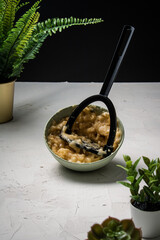 Mashing a bowl of bananas,
