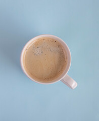 cup of coffee on blue background 