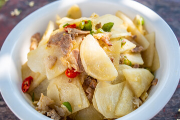 Chinese home-cooked fried pork with cold potato