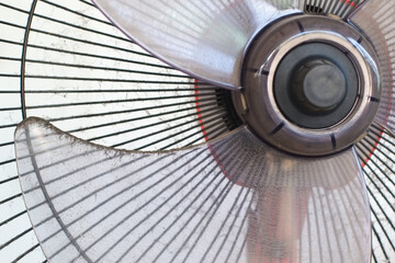 Dust dirty on blades of plastic fan close-up.