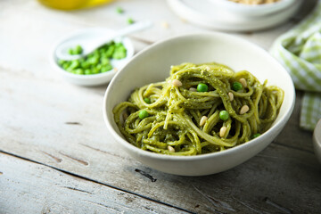 Spaghetti with pesto sauce and green pea