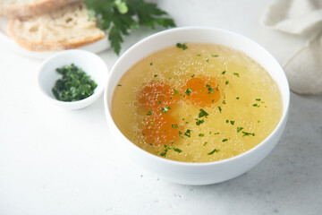 Traditional homemade chicken stock with vegetables