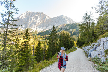 Naklejka premium Young beautiful woman traveler , mountains Alps background,