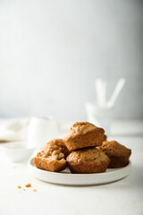 Fototapeta na wymiar Homemade assorted muffins with lemon, cinnamon and nuts