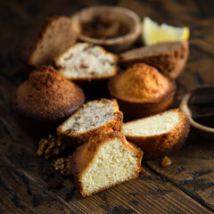 Fototapeta na wymiar Homemade assorted muffins with lemon, cinnamon and nuts