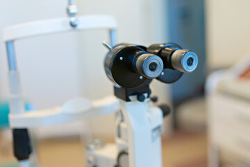 Fototapeta na wymiar Checking the eye vision with modern optical equipment. Ophthalmology medical equipment. 