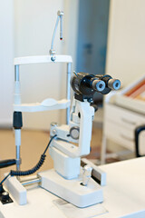 Checking the eye vision with modern optical equipment. Ophthalmology medical equipment. 