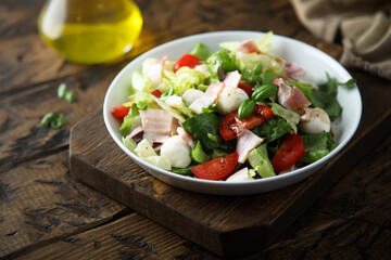 Vegetable salad with bacon and mozzarella 