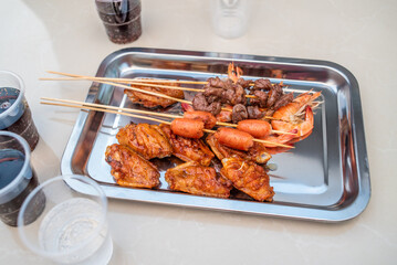A plate of BBQ food and drinks