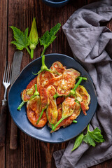 Healthy fried zucchini flower as unique summer vegetarian snack.