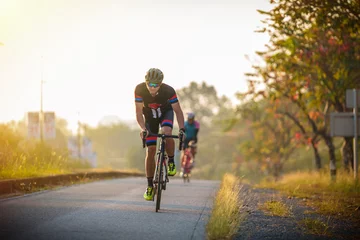 Keuken foto achterwand cyclist leads in action,Front view man riding bicycle in the racing road © pixfly