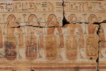 Colorful painting with the traditional motif of bound prisonres, with the names of the foreing...