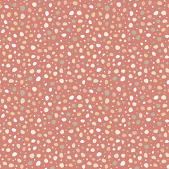 Doodle dots hand drawn, simple abstract seamless pattern in polka dot style. Smooth shapes in pastel palette on muted red background. Random spots design