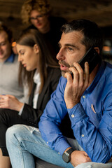 Fototapeta premium Talking on the phone with his boss