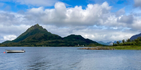 View of a Norwegian fjord with a boat and mountains