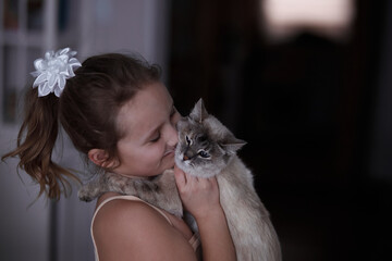 portrait girl kissing her white grey cat