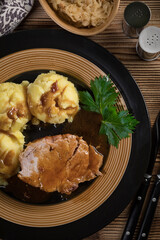 Braised pork neck in own sauce. Shallow depth of field.