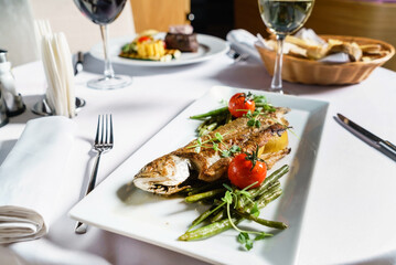 grilled fish with vegetables and wine