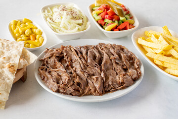 Doner kebab on a white background. Traditional Turkish cuisine flavor meat doner. With lavash...