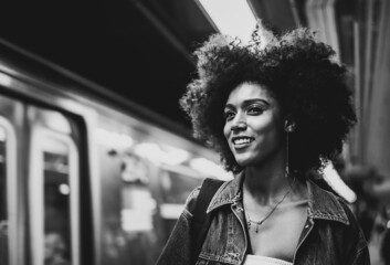 Cinematic portraits of a beautiful american young woman with curly hair in New york. Concept about...