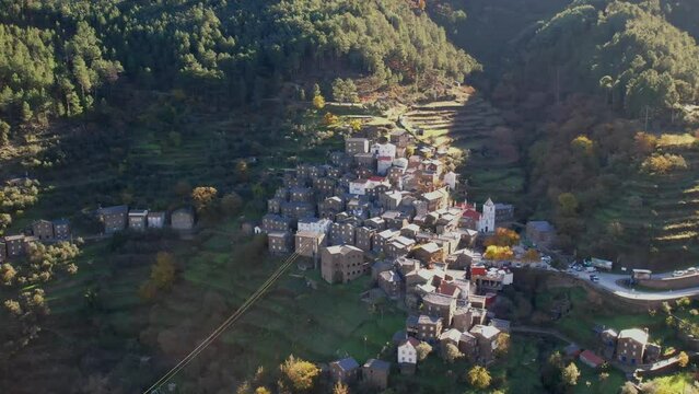DRONE AERIAL FOOTAGE: The picturesque little schist villages of Piod&atilde;o clings to a steeply terraced mountainside deep within the foothills of the Serra de A&ccedil;or range in central Portugal.