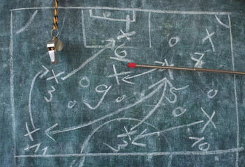 Soccer or football tactics scribble with the trainers whistle and pointer stick on blackboard....