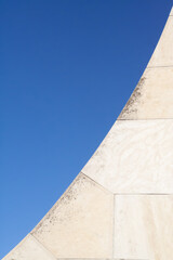 Abstract white curve in the architecture of the Madrid cathedral with blue sky in the background